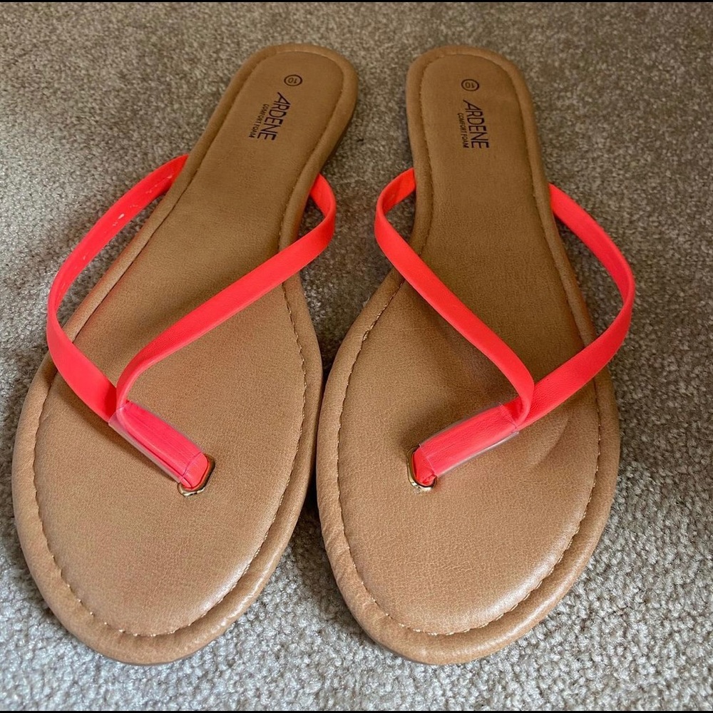 Ardene flat sandals with coral straps. Never worn